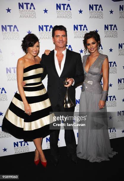 Factor judges Danni Minogue, Simon Cowell and Cheryl Cole appear with their award for Most Popular Talent Show at the National Television Awards held...