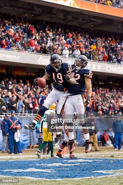 Matt Forte and Devin Aromashodu both of the Chicago Bears celebrate a touchdown against the Green Bay Packers at Soldier Field on December 13, 2009...