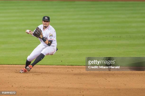 Miami Marlins shortstop Miguel Rojas throws to first base for the second out of the ninth inning against the Los Angeles Dodgers on Tuesday, May 15,...