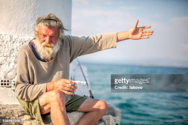 old fisherman  by the sea - blue eyed soul stock pictures, royalty-free photos & images