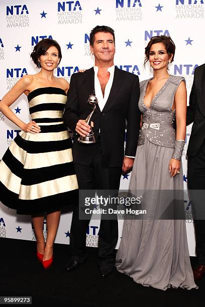 Dannii Minogue, Simon Cowell and Cheryl Cole pose with the most popular talent show award awarded to X Factor in the press room at the National...