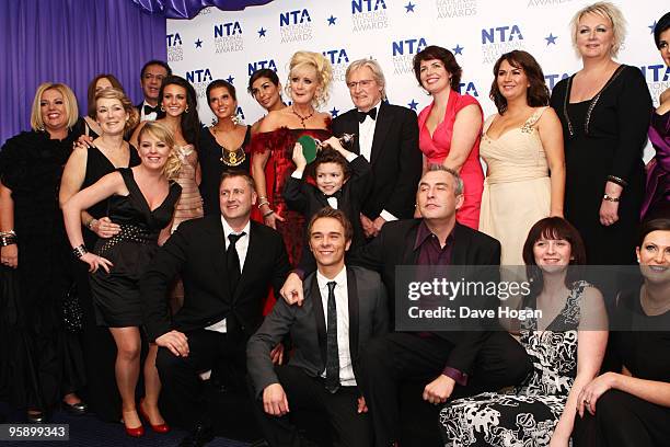 The cast of Coronation Street pose in the press room with their most popular serial drama award at the National Television Awards held the at The O2...