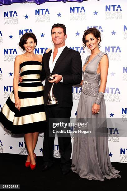 Dannii Minogue, Simon Cowell and Cheryl Cole pose with the most popular talent show award awarded to X Factor in the press room at the National...