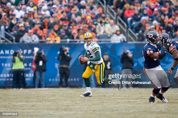 Aaron Rodgers of the Green Bay Packers scrambles against the Chicago Bears at Soldier Field on December 13, 2009 in Chicago, Illinois.