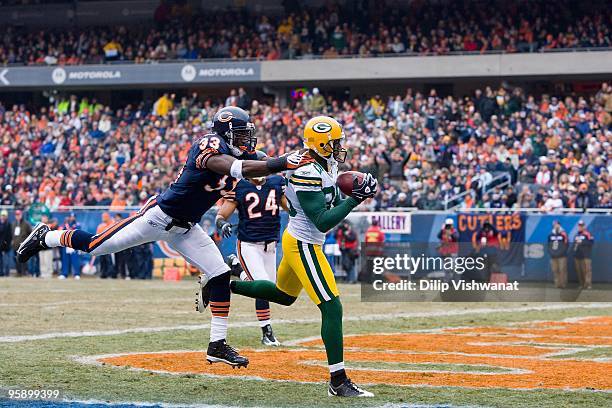 Greg Jennings of the Green Bay Packers attempts to make a catch against Charles Tillman of the Chicago Bears at Soldier Field on December 13, 2009 in...