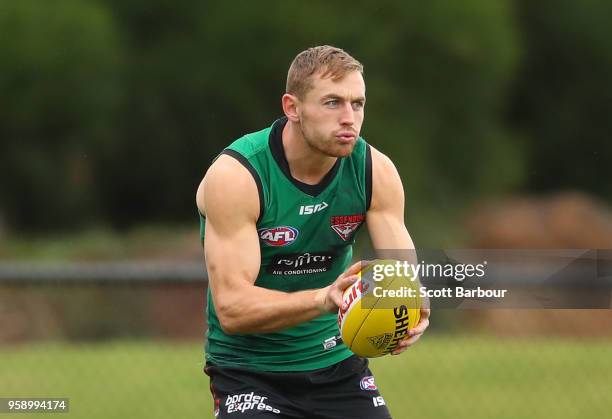 Devon Smith of the Bombers runs with the ball during an Essendon Bombers AFL training session at The Hangar on May 16, 2018 in Melbourne, Australia.