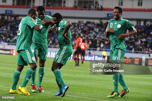 Obafemi Martins of Nigeria celebrates his goal with John Obi Mikel and Obinna Nsofor during the African Nations Cup Group C match between Nigeria and...