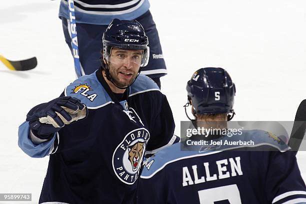 Bryan Allen is congratulated by Radek Dvorak of the Florida Panthers after scoring a goal against the Tampa Bay Lightning on January 16, 2010 at the...