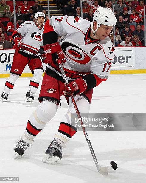 Rod Brind'Amour of the Carolina Hurricanes turns up ice with the puck during a NHL game against the Detroit Red Wings at Joe Louis Arena on January...