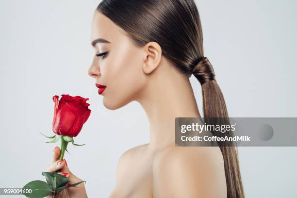 beautiful girl with red rose - happy birthday red roses stock pictures, royalty-free photos & images