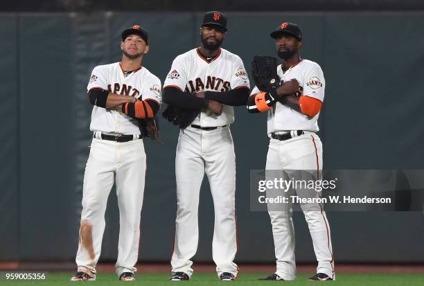 Gregor Blanco, Austin Jackson and Andrew McCutchen of the San Francisco Giants celebrate defeating the Cincinnati Reds 5-3 at AT&T Park on May 15,...
