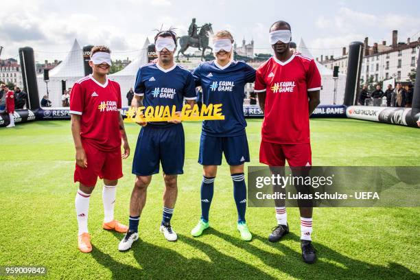 Shanice van de Sanden , Luis Figo, Ada Hegerberg and Eric Abidal pose masks to feel like a blind soccer player during the EqualGame Match at the Fan...