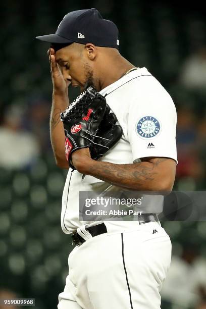 Juan Nicasio of the Seattle Mariners reacts after giving up a run in the eighth inning against the Texas Rangers at Safeco Field on May 15, 2018 in...