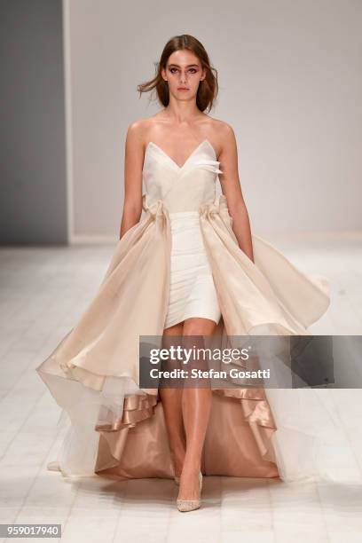 Model walks the runway in a design by VIVAN TUNG during the Raffles International Showcase show at Mercedes-Benz Fashion Week Resort 19 Collections...