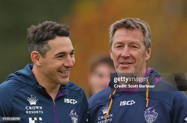 Billy Slater of the Melbourne Storm and Storm coach Craig Bellamy talk during a Melbourne Storm NRL media session at Gosch's Paddock on May 16, 2018...