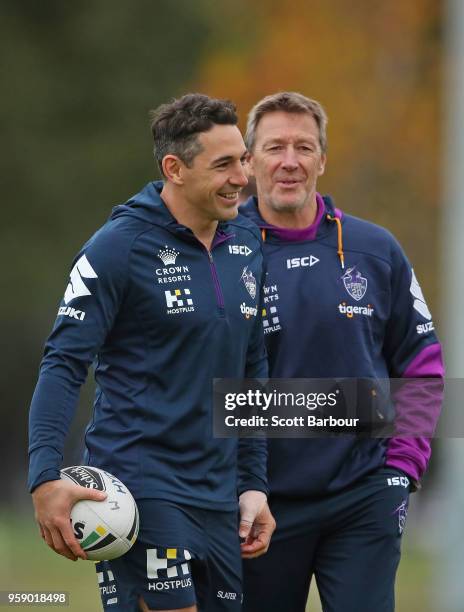 Billy Slater of the Melbourne Storm and Storm coach Craig Bellamy talk during a Melbourne Storm NRL media session at Gosch's Paddock on May 16, 2018...