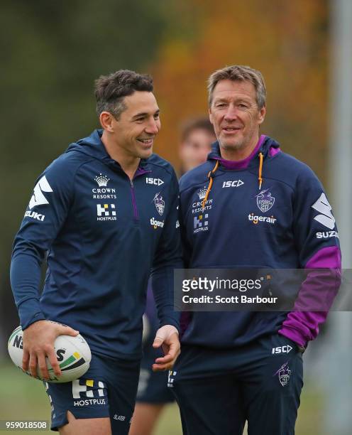 Billy Slater of the Melbourne Storm and Storm coach Craig Bellamy talk during a Melbourne Storm NRL media session at Gosch's Paddock on May 16, 2018...