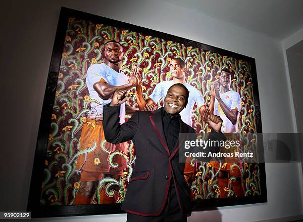 Artist Kehinde Wiley stands in front of his painting during the PUMA - Kehinde Wiley vernissage on January 20, 2010 in Berlin, Germany.