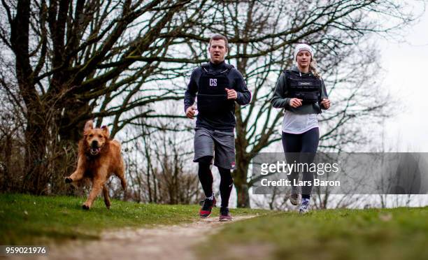 Kevin Winkens of Crossfit Vitus runs with his girlfriend Lea and dog James on January 9, 2018 in Moenchengladbach, Germany. Winkens qualifyed for the...