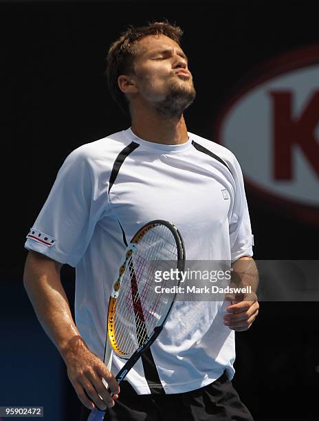 Marco Chiudinelli of Switzerland reacts after a point in his second round match against Novak Djokovic of Serbia during day four of the 2010...