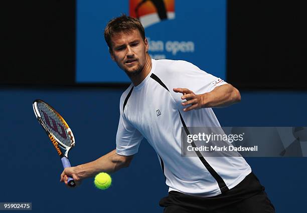 Marco Chiudinelli of Switzerland plays a forehand in his second round match against Novak Djokovic of Serbia during day four of the 2010 Australian...