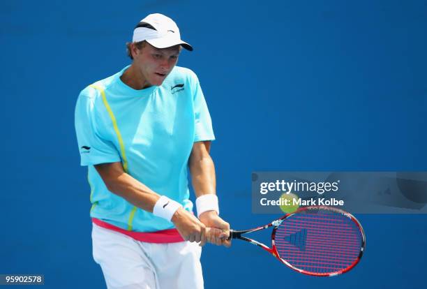 Denis Istomin of Uzbekistan plays a backhand in his second round match against Michael Berrer of Germany during day four of the 2010 Australian Open...