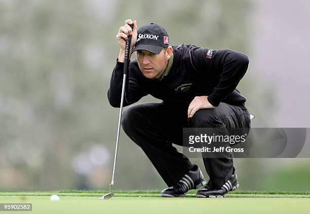 George McNeill lines up a putt on the ninth green during the first round of the Bob Hope Classic at the La Quinta Country Club on January 20, 2010 in...