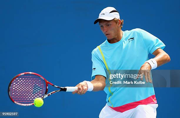 Denis Istomin of Uzbekistan plays a forehand in his second round match against Michael Berrer of Germany during day four of the 2010 Australian Open...