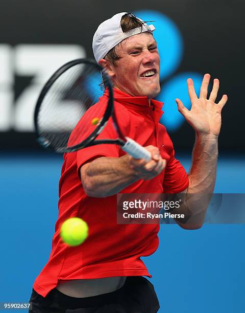 Illya Marchenko of Ukraine plays a forehand in his second round match against Nikolay Davydenko of Russia during day four of the 2010 Australian Open...