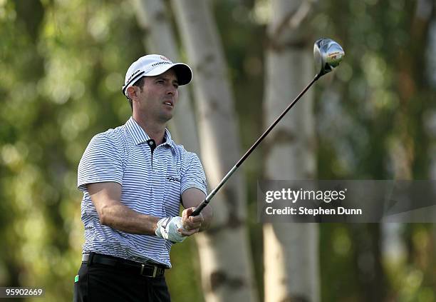 Mike Weir of Canada watches his tee shot on the second hole on the Palmer Private Course at PGA West during the first round of the Bob Hope Classic...