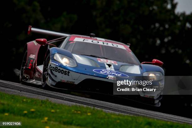 The Ford GT of Dirk Mueller, of Germany, and Joey Hand races on the track during the Acura Sports Car Challenge at Mid-Ohio, Mid-Ohio Sports Car...