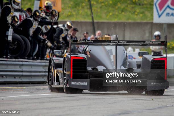 The Cadillac DPi of Joao Barbosa, of Portugal, and Felipe Albuquerque, of Portugal, makes a pit stop during the Acura Sports Car Challenge at...