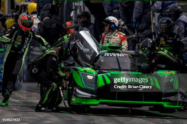 The Nissan DPi of Ryan Dalziel, of Great Britain, and Scott Sharp makes a pit stop during the Acura Sports Car Challenge at Mid-Ohio, Mid-Ohio Sports...