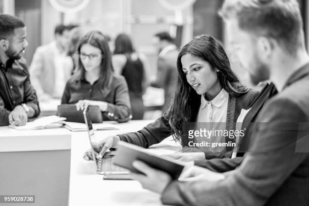 standing group of business people in the meeting - black and white stock pictures, royalty-free photos & images