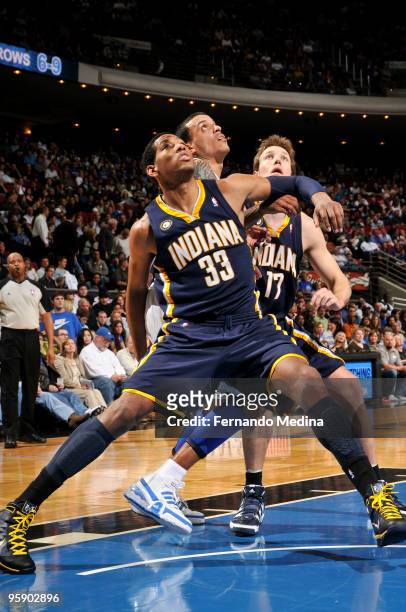 Danny Granger of the Indiana Pacers boxes out against Matt Barnes of the Orlando Magic during the game on January 20, 2010 at Amway Arena in Orlando,...