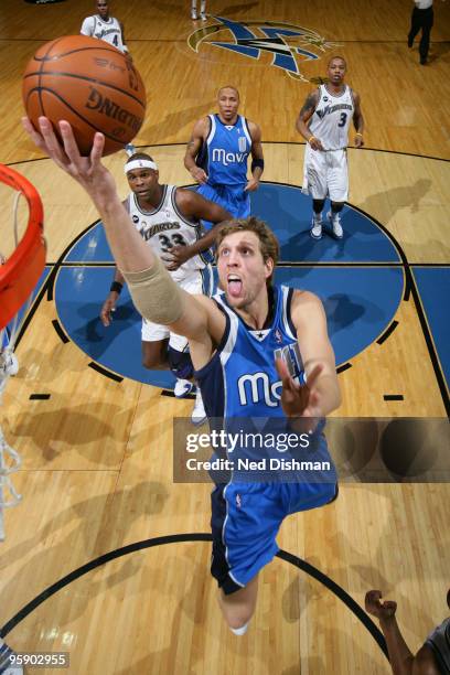 Dirk Nowitzki of the Dallas Mavericks shoots against Brendan Haywood of the Washington Wizards at the Verizon Center on January 20, 2010 in...