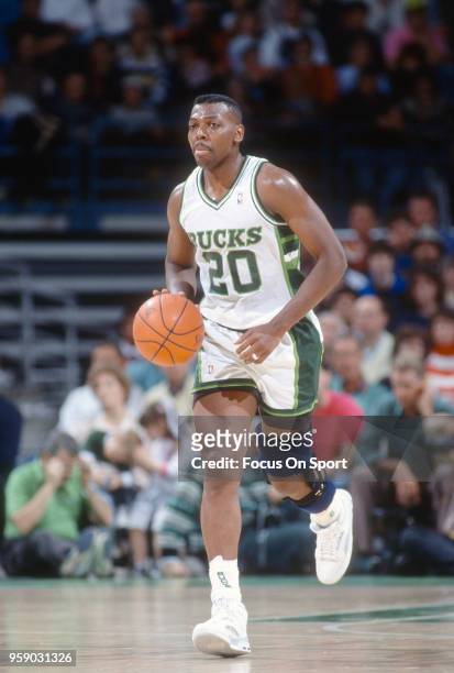 Jeff Grayer of the Milwaukee Bucks dribbles the ball up court during an NBA basketball game circa 1990 at the Bradley Center in Milwaukee, Wisconsin....