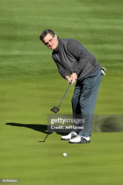 Kurt Russell hits a putt on the 12th green during the first round of the Bob Hope Classic at the Silver Rock Resort on January 20, 2010 in La Quinta,...