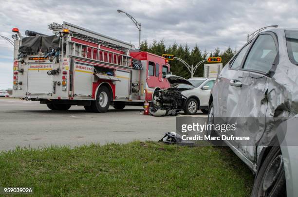 two cars crashed in accident with firetruck behind - car accident stock pictures, royalty-free photos & images