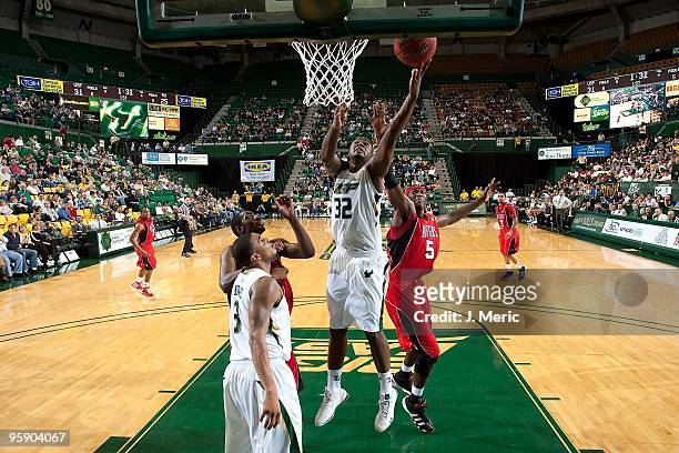 Toarlyn Fitzpatrick of the South Florida Bulls drives to the basket against the Rutgers Scarlet Knights during the game at the SunDome on January 16,...