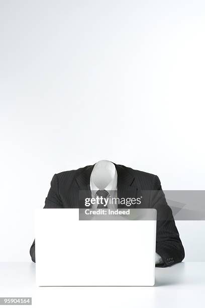 invisible businessman using laptop - headless man 個照片及圖片檔