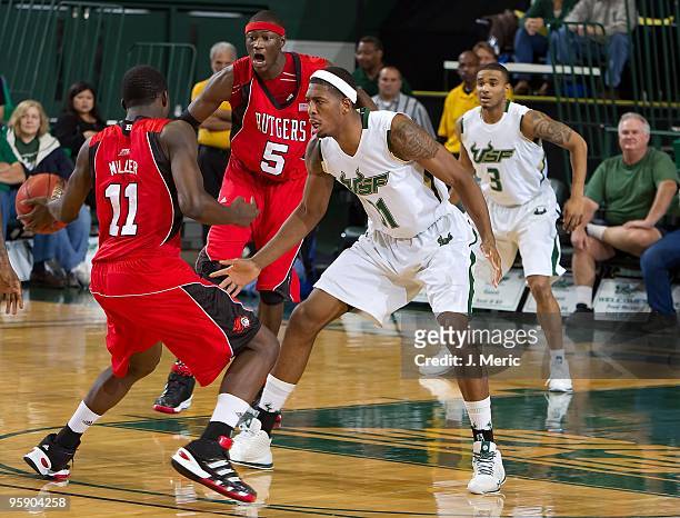 Jarrid Famous of the South Florida Bulls defends against the Rutgers Scarlet Knights during the game at the SunDome on January 16, 2010 in Tampa,...