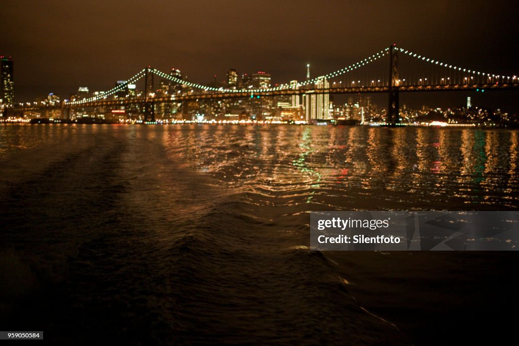 View of San Francisco Night Skyline From Aboard Ferry Crossing SF Bay