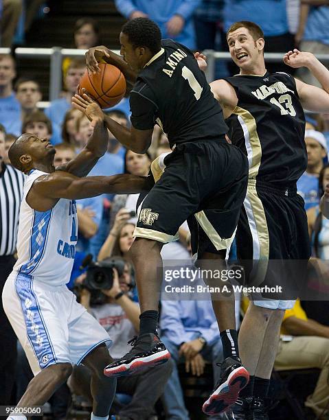 Al-Farouq Aminu of the Wake Forest Demon Deacons pulls down one of his game high 11 rebounds during second half action against the North Carolina Tar...