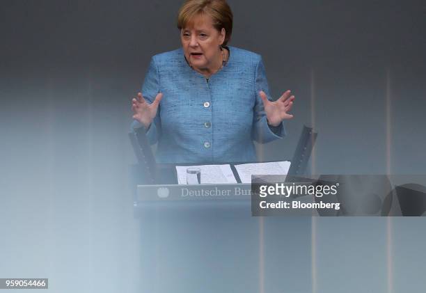 Angela Merkel, Germany's chancellor, gestures while speaking to lawmakers during a budget policy plan speech in the lower-house of the Bundestag in...