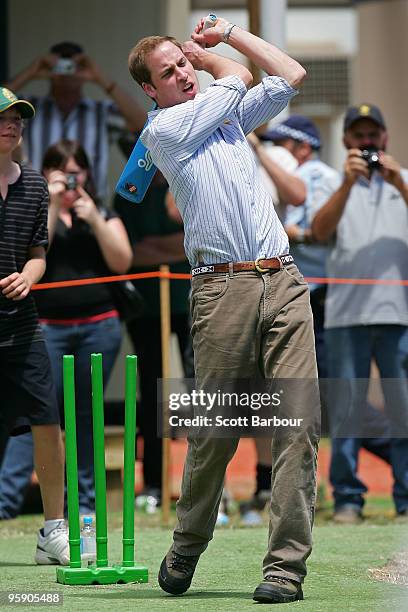 Prince William bats as he plays a game of cricket at the Flowerdale temporary village as he visits people affected by the 2009 bushfires on the third...