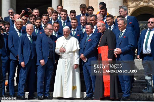 Pope Francis poses with football team Rapid Vienna and cardinal Christoph Schönborn at the end of a weekly general audience at St Peter's square on...