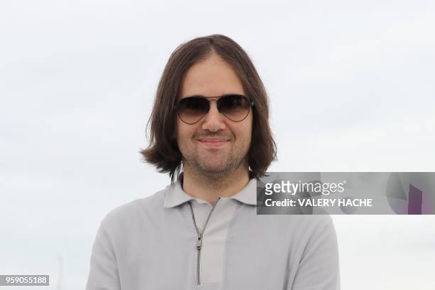 Director David Robert Mitchell poses on May 16, 2018 during a photocall for the film "Under the Silver Lake" at the 71st edition of the Cannes Film...