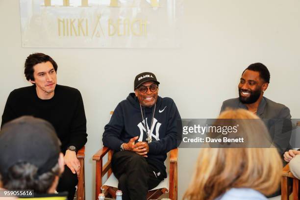 Adam Driver, Spike Lee and John David Washington at the HFPA Lounge at Nikki Beach on May 16, 2018 in Cannes, France.