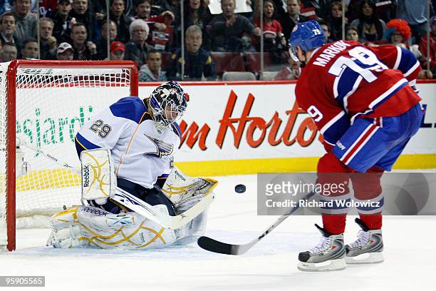 Ty Conklin of the St. Louis Blues stops the puck on a shot by Andrei Markov of the Montreal Canadiens during the overtime period of the NHL game on...